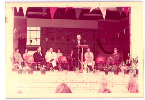 People on a stage during a 1973 opening presentation